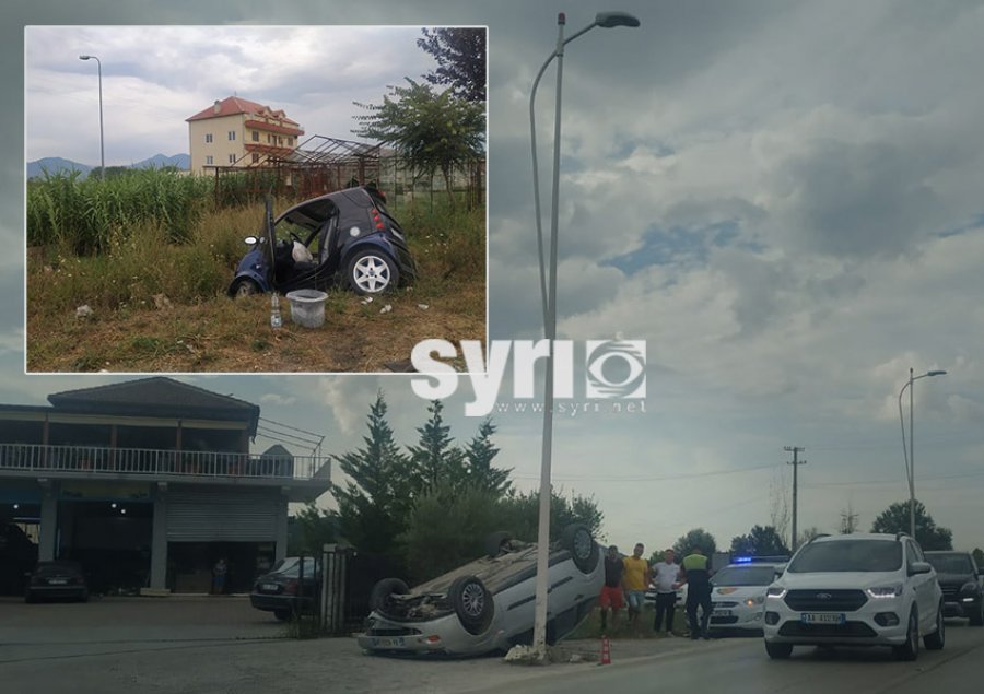 FOTO/ Përplasen dy makina në Rinas, njëra përfundon e përmbysur në rrugë